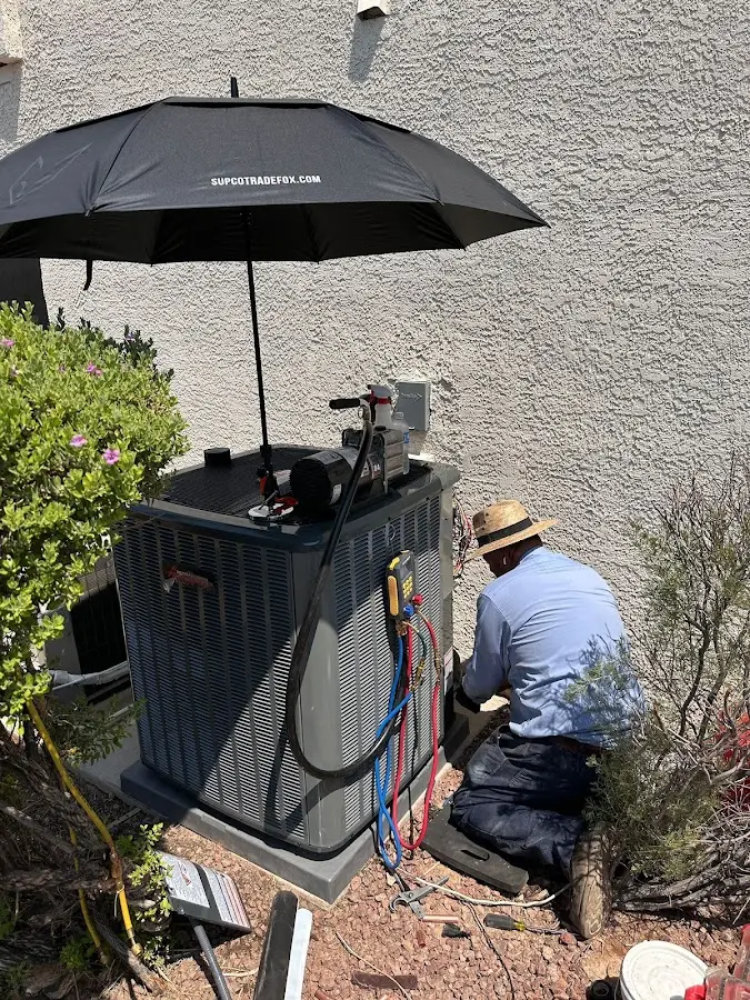 HVAC technician performing outdoor AC maintenance in Depew